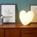 Colored heart-shaped table lamp Slide Love, produced in Italy