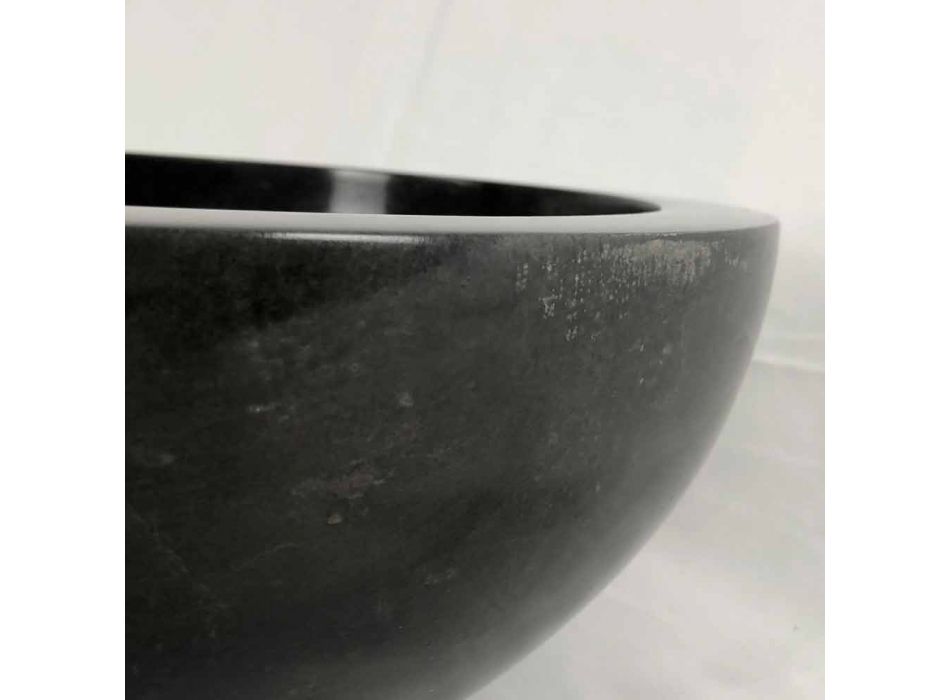 Black round countertop washbasin in Levi natural stone, unique piece