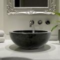 Black round countertop washbasin in Levi natural stone, unique piece