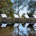 Outdoor Sunbed with Wheels in Hand Woven Polyrattan - Gigi Viadurini