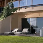 Outdoor Sunbed in Polyrattan with Wheels - Meredith Viadurini