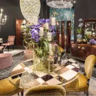 Modeno round table with glass top and Ozzy wood inlays Viadurini