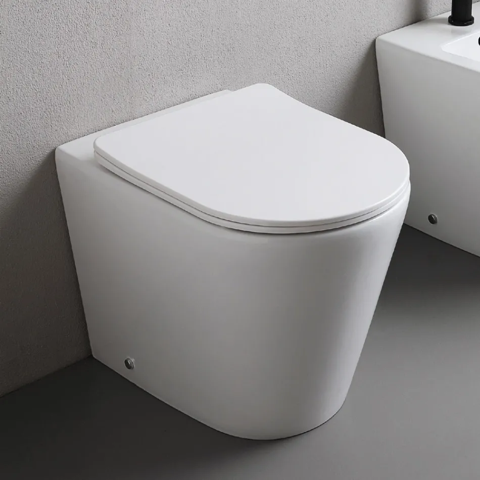 Floor-mounted toilet with slim soft-close seat in white ceramic - Salice Viadurini